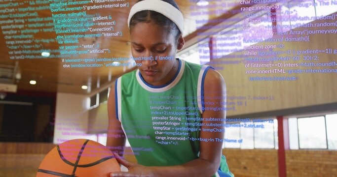 Displaying female athlete showcasing overlaid code on gym court, with basketball, jersey, headband - Powered by Adobe