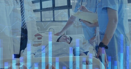 Reviewing medical team in uniforms monitoring patient charts at bedside, with tablet overlay graphs