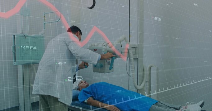 Adjusting doctor positioning ceiling-mounted X-ray over patient on imaging table, with line chart