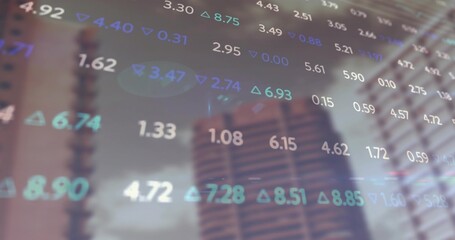 Displaying semi-transparent stock values with green and blue trend arrows over blurred city towers