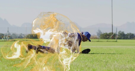 Female baseball player diving on grass field, with blue cap, jersey, glove and golden energy swirl