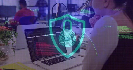 Woman wearing sleeveless top typing code in office, with laptop security shield overlay, copy space