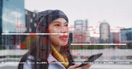 Using smartphone, woman wearing beanie scanning augmented reality overlay on rooftop terrace