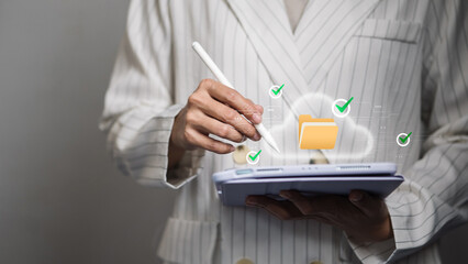 Cloud data management workflow, businesswoman using tablet with secure digital folder and check mark icons