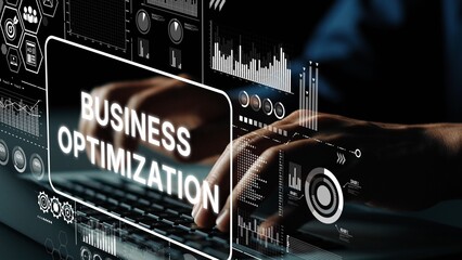Hands Typing on Keyboard with Business Optimization Graphics and Digital Data Analysis Elements in...