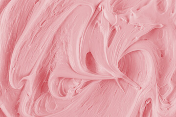Delicate swirl curls of the texture of creamy fruit cream. pink texture with a pattern. A sample of the pink berry texture cream. selective focus. © Marina