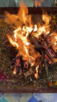 Close up of flames in havan kund in havan puja, a ceremony in hindu religion with all ingredients