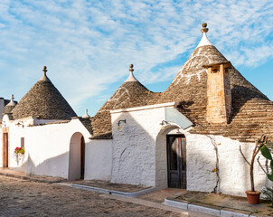 wonderful white mediterranean architecture of italian buildings with sdtrange conic roofs and wfite...