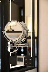 Circular mirror in the bathroom