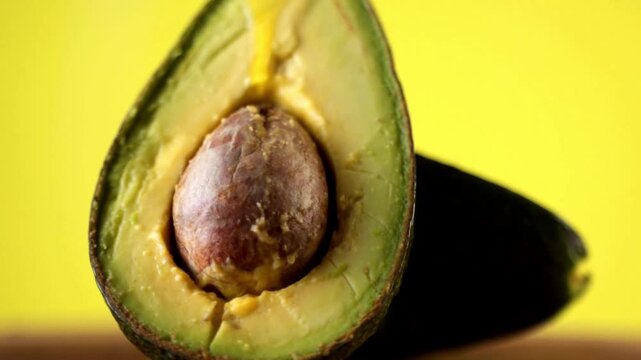 guacamole. Healthy food concept. close-up of fresh avocado fruit and oil flowing over black background healthy vegetarian delicious Breakfast Toas