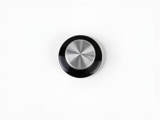 Round metal knob on white surface with sleek design  