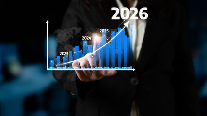 A business professional interacts with a futuristic graph that highlights data projections from...