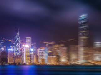 A radial blur effect transforms the Hong Kong skyline at night into an abstract vision. The lights...