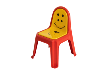 A cheerful red and yellow plastic child's chair featuring a smiley face design on the backrest and seat, perfect for kids. background removed
