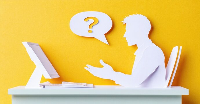 Paper cutout depicts person using computer. Question mark floats near hands, suggesting inquiry or problem solving. Bright yellow background.
