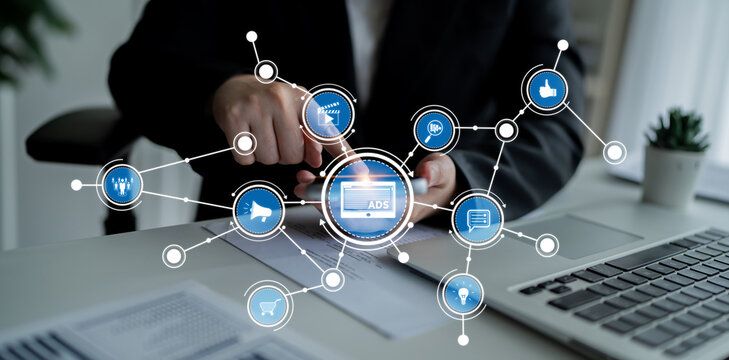 A business professional interacts with a mobile device in a modern workspace, showcasing digital advertising concepts and connectivity through visual elements. Crux - Powered by Adobe