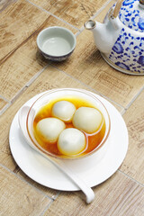 Black sesame dumplings in ginger syrup, Chinese sweet dessert