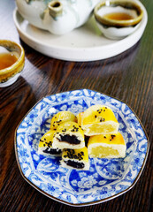 Chinese pastry dessert (Fresh milk mooncakes) with tea, Chinese culture sweet