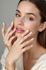 Beautiful girl hand care  . Model woman showing  french  shellac manicure on nails   . Cosmetics ,beauty and makeup