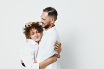 A professional businessman shares a warm embrace, expressing trust and care. Isolated on a clean colored background, the moment captures emotion and connection.