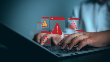 Cybersecurity Warning and System Error Alert Concept on Laptop Computer