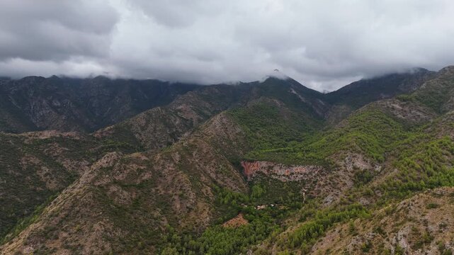 Aerial Landscape views of Ojen town. Ojen is a town and municipality that sits in the mountains behind Marbella in the autonomous community of Andalusia in southern Spain. Ambient drone exploration.