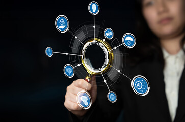 A business professional engages with a futuristic digital interface, highlighting various icons representing technology and innovation concepts in a modern workspace. Crux