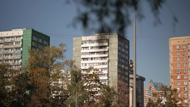 View of the facade of a high-rise building of Soviet design. Dolly camera