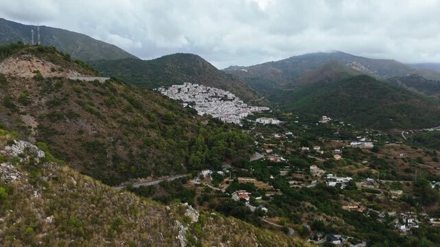 Aerial Landscape views of Ojen town. Ojen is a town and municipality that sits in the mountains behind Marbella in the autonomous community of Andalusia in southern Spain. Ambient drone exploration.