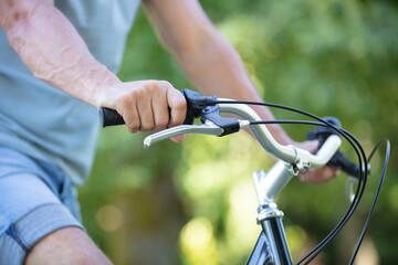 a man is riding a bicycle in a forest