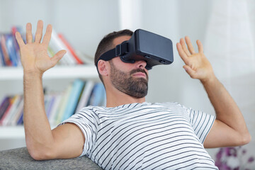 amazed man wearing a virtual reality mask