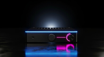 Obraz premium Sleek Black Audio Device with Striking Neon Blue and Pink Glow. Modern High-Tech Sound Component on Reflective Dark Surface, Dynamic LED Illumination.