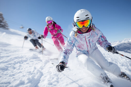 Close up, Family skiing on snowy mountain slopes during holidays