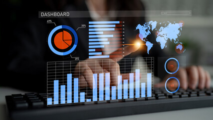 A focused businessperson interacts with a digital dashboard, analyzing various data visualizations and global maps to enhance strategic decision-making and performance analysis. Impute