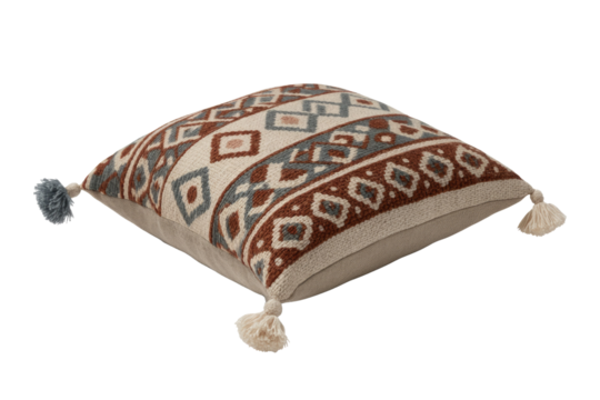 A stylish woven throw pillow featuring a geometric tribal pattern in cream, brown, and blue-grey, accented with decorative tassels on its corners. background removed