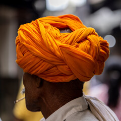 Orange hindu turban in Pushkar (India).