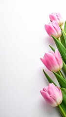 A beautiful bouquet of pink tulips with fresh green leaves rests on a rustic wooden background, symbolizing spring's beauty and a thoughtful floral gift