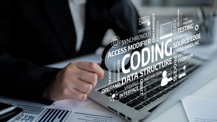 A professional software developer focuses on coding tasks using a laptop, showcasing various programming concepts and terms related to technology and business. Tessel