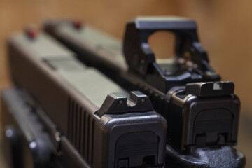 Comparison of pistol sighting systems: Classic mechanical iron sights versus a modern red dot optic...