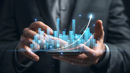 Businessman using smartphone showing digital chart and financial growth concept.