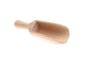 Obraz premium Wooden scoop crafted from light-colored wood, featuring a smooth handle and a deep bowl, ideal for serving dry ingredients in kitchens and bakeries, showcasing craftsmanship and utility