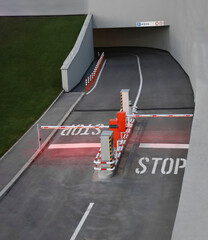 empty double Entrance to the underground parking of private residential building and 2 two barriers gate Asphalt road way Top view/