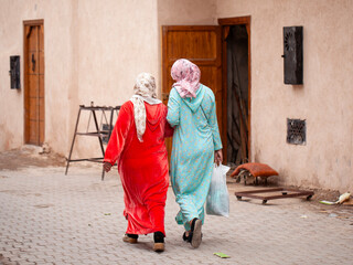 Two women walking in Marrakech (Morocco).