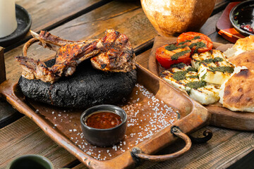 food concept grilled meat and fried vegetables tasty dish meal in restaurant