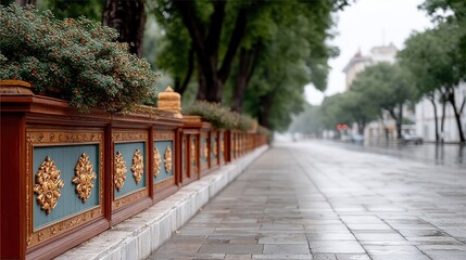 Fototapeta premium Ornate Golden Monastery Carvings on Teal Wall with Lush Greenery and Reflective Pavement After Rain