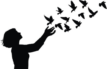 Silhouette of a woman releasing birds into sky, symbolizing freedom, hope, and new beginnings 