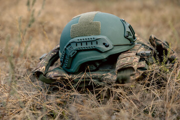 a bulletproof vest and a military helmet are lying. uniforms and modern weapons of the army. preparation for a special operation to destroy terrorists