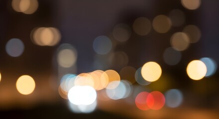Abstract bokeh lights of city at night with warm and cool tones
