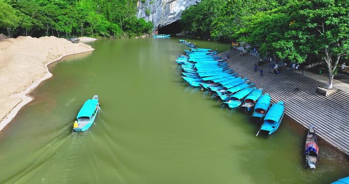 Aerial view of Scenic the Son River from Phong Nha Cave at Phong Nha-Ke Bang National Park in Vietnam. Tourist boat leaving the wet cave.