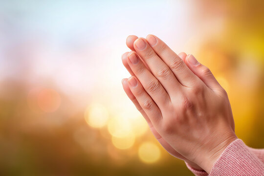 Praying hands on blessing background with defocused light, faceless faith gesture, devotion visualization detail, blurred spiritual setting, hope power concept, love interface, pra